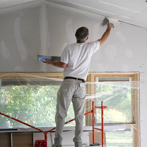 Applying mud to freshly taped sheetrock. Applying mud to freshly taped sheetrock.
